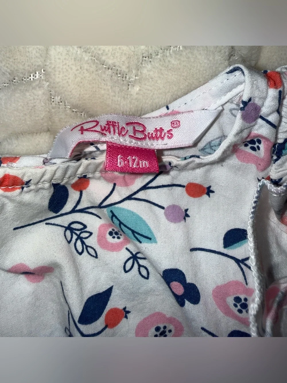 Ruffle Butts floral patterned white baby romper, size 6-12 mos